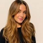 Woman with warm caramel blonde hair color