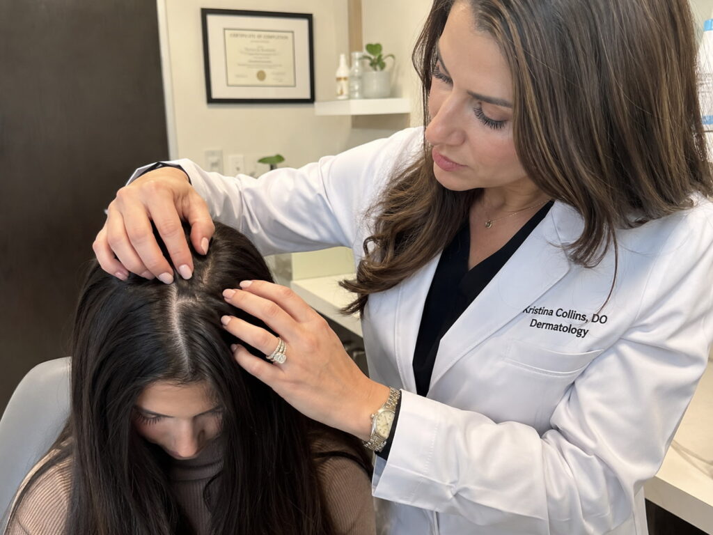 Dermatologist examining scalp to diagnose oily hair causes