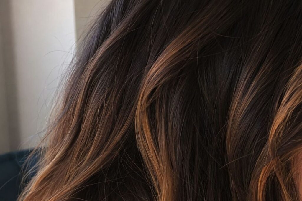 Brunette highlights showing warm orange undertones