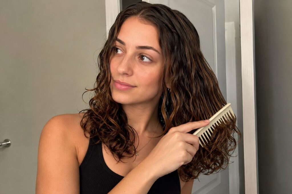 Brushing out curls with a wide tooth comb