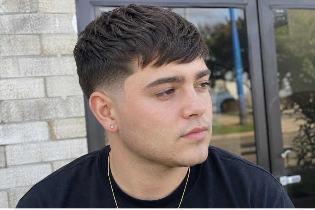 Caesar crop hairstyle for round face shape men