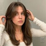 DIY curtain bangs cut and styled at home