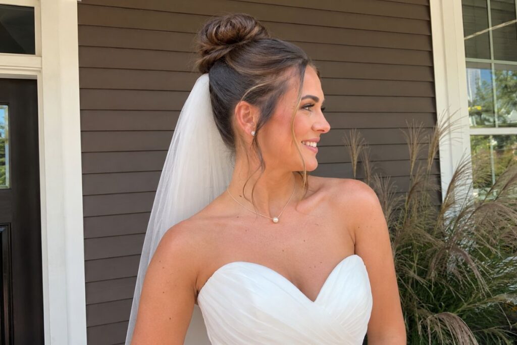 High bun wedding hairstyle for round face