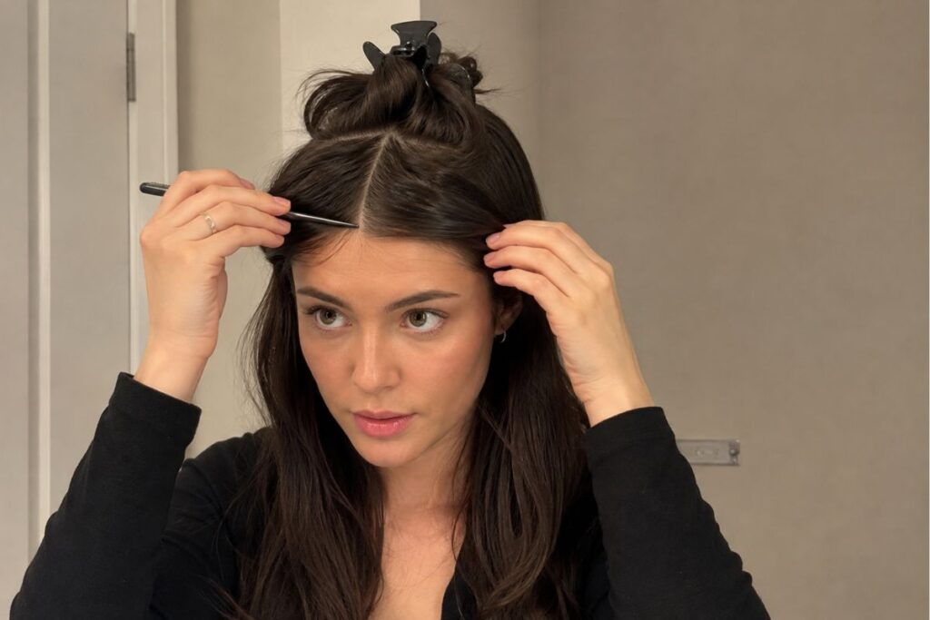 Sectioning hair into a triangle for curtain bangs